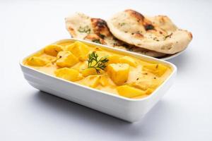 Dahi Aloo sabzi or curd potato curry photo