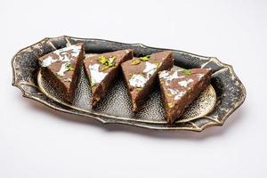 chocolate barfi or choco burfi cake, a tweak to indian dessert or sweet for festivals photo