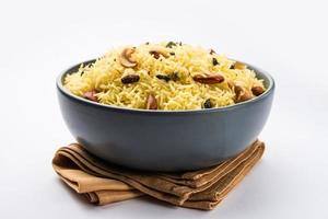 Kashmiri sweet modur pulao made of rice cooked with sugar, water flavored with Saffron and dry fruits photo