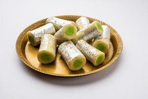 Kaju Pista Roll Or Cashew Pistachio Rolls Mithai or sigar, Indian sweet or dessert for festivals photo