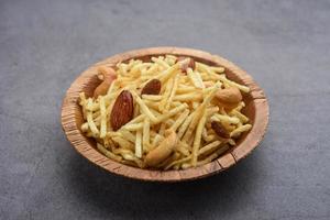 Indian style deep fried snacks falahari chivda, Chewda - chivda or mixture namkeen with dry fruits photo