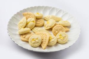 Sandesh or shondesh is a dessert, originating from the Bengal, India, created with milk and sugar photo