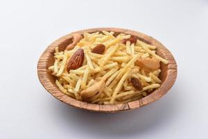 Indian style deep fried snacks falahari chivda, Chewda - chivda or mixture namkeen with dry fruits photo