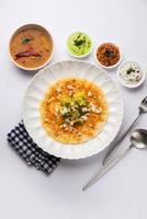 Mysore Masala Dosa or open dosa served with sambar and chutney, selective focus photo