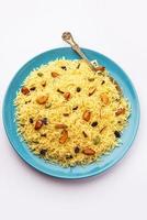 Kashmiri sweet modur pulao made of rice cooked with sugar, water flavored with Saffron and dry fruits photo