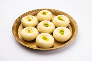 Sandesh or shondesh is a dessert, originating from the Bengal, India, created with milk and sugar photo