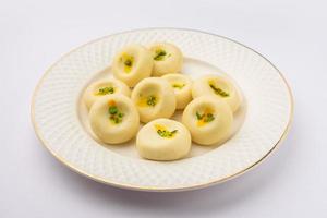 Sandesh or shondesh is a dessert, originating from the Bengal, India, created with milk and sugar photo