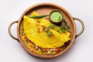 cheela, Chilla or Chila is a Rajasthani breakfast dish generally made with gram flour or besan photo