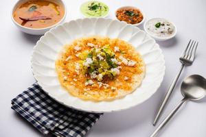 Mysore Masala Dosa or open dosa served with sambar and chutney, selective focus photo