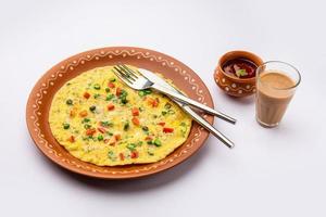 Indian Spiced Masala Omelet filled with fresh vegetable, healthy meal photo