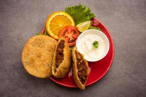 Keema kachori is a popular indian or pakistani flacky, crispy and delicious snack with yummy qeema filling also known as Khasta Kheema Kachauri photo