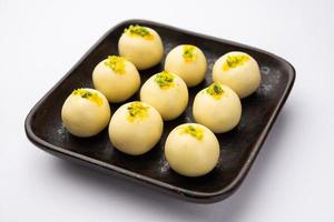 Sandesh or shondesh is a dessert, originating from the Bengal, India, created with milk and sugar photo