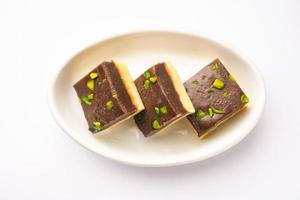 Choco Vanilla Patisa or chocolate mawa barfi or or two layered burfi, Indian sweet or dessert photo