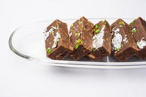 chocolate barfi or choco burfi cake, a tweak to indian dessert or sweet for festivals photo