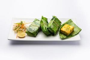 patrani paneer, a paneer marinated in sauce and barbecued and then covered in leaf photo