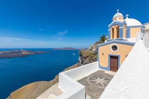 Beautiful Greek church bell tower. Santorini island, Greece, Europe. Luxury vacation background concept, travel concept. Famous places, mediterranean landscape, summer vacation and holiday. photo