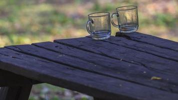 Still life with empty glasses on rustic table photo