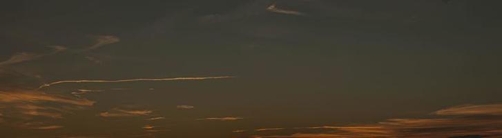 Dramatic colorful sky with afterglow and illuminated clouds photo