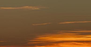 Dramatic colorful sky with afterglow and illuminated clouds photo