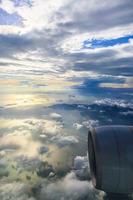 Aerial picture of clouds from airplane with airplane engine photo