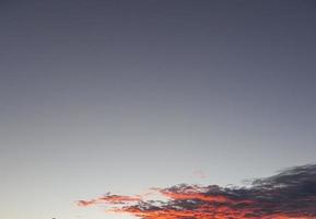 Dramatic colorful sky with afterglow and illuminated clouds photo