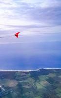 Flying in plane over coast of Oaxaca Mexico. photo