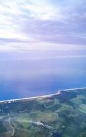 Flying in plane over coast of Oaxaca Mexico. photo