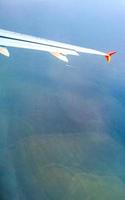 Flying in plane over coast of Oaxaca Mexico. photo