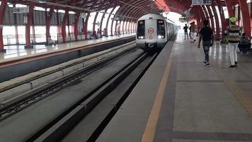 Delhi India -June 21 2022 -Delhi Metro train arriving at Jhandewalan metro station in Delhi, India, Asia, Public Metro departing from Jhandewalan station in which more than 17 lakhs passengers travel video