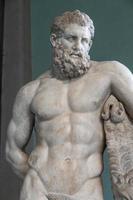 Florence, Italy - Hercules antique sculpture - classical statue, strong man body. photo