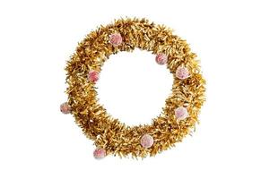 A traditional Christmas decoration for the new year. A wreath of gold coniferous wood with red christmas ball isolated on white background, clipping path include photo