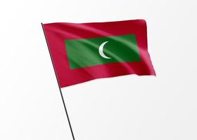 Maldives flag flying high in the isolated background Maldives independence day photo