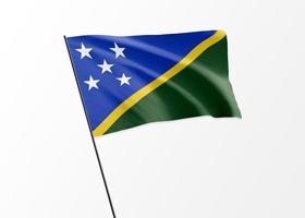 Solomon Island flag flying high in the isolated background Solomon Island independence day photo