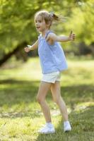 Little girl having fun in the park photo