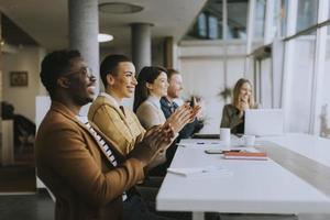 Group of business people working together and preparing new project on a meeting in office photo