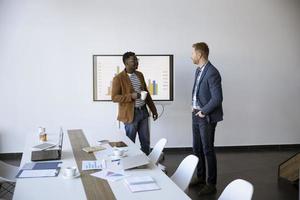 Multiethnic young business men working together in the office photo