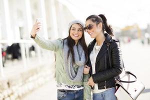 Young women takin selfie outdoor photo
