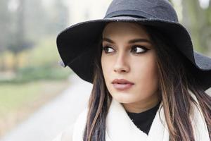 Pretty young woman with hat photo