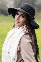 Pretty young woman with hat photo