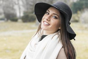 Pretty young woman with hat photo