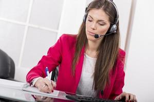 Pretty young woman in the office photo