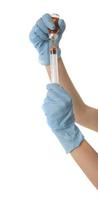 Woman Nurse with protective workwear holding Vaccine and syringe photo