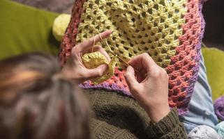 unrecognizable woman knitting photo