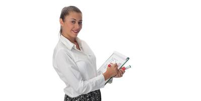 Happy young businesswoman doing business presentation at whiteboard, smiling, isolated on white background. photo