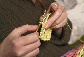 unrecognizable woman knitting photo