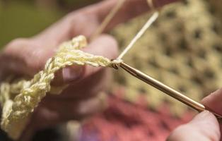 unrecognizable woman knitting photo