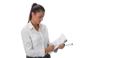 Happy young businesswoman doing business presentation at whiteboard, smiling, isolated on white background. photo