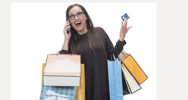 Happy woman with shopping bag on isolated studio background. photo