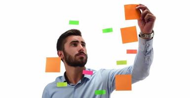 Portrait of a smiling businessman writing Business Plan on the screen photo