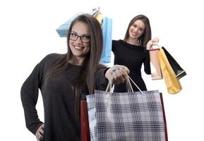 Happy friends with shopping bag on isolated studio background. photo